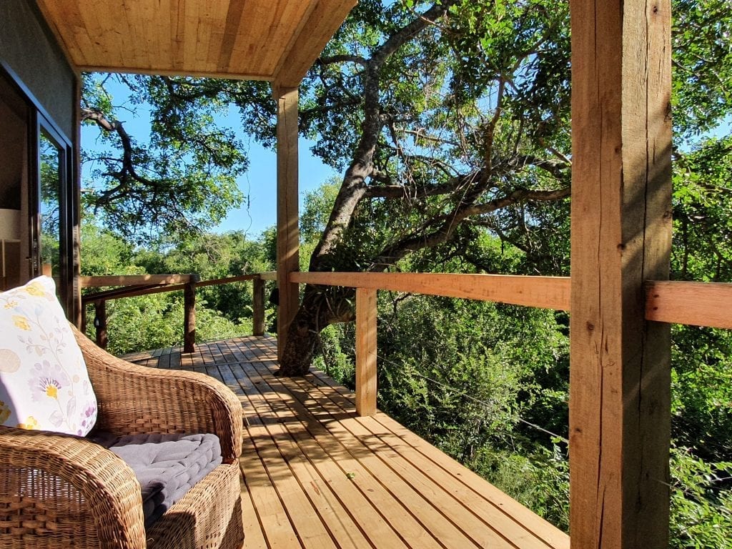 Kingfisher Creek Lodge - African Safari Lodge- Deck overlooking bush